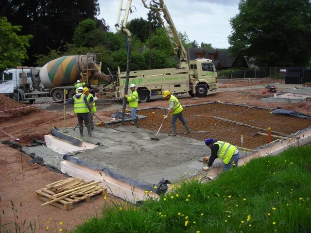 Concrete being placed into the ISOQUICK insulated raft using a pump